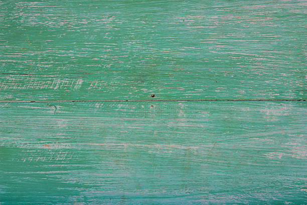 istock Green peeling from wooden planks. 475835268