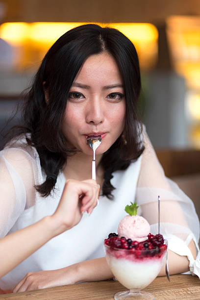 istock Woman eating ice cream 475835558