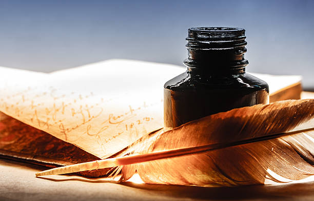 altes buch mit feder feder - ink bottle stock-fotos und bilder