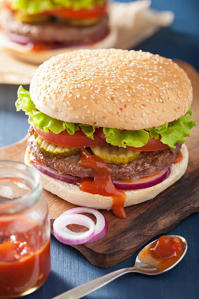istock burger with beef patty lettuce onion tomato ketchup 475839698