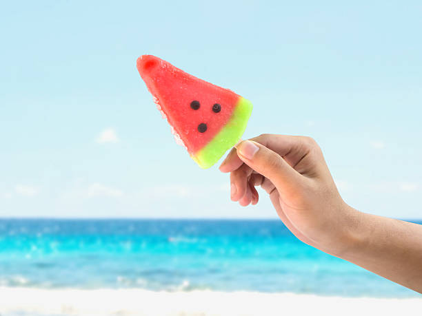 istock Hand holding ice cream watermelon shape 475839866