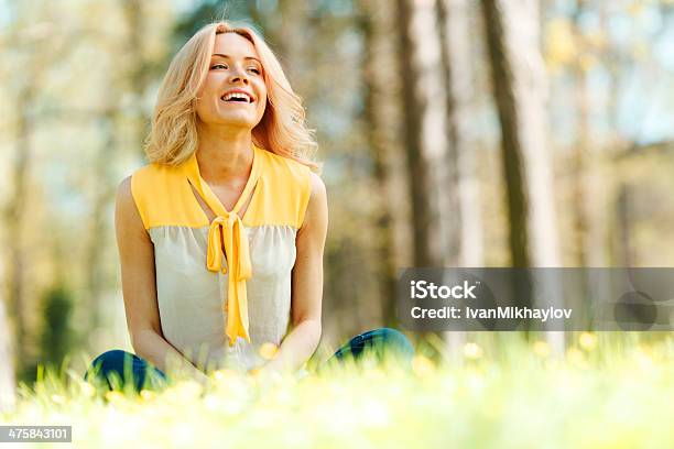 Woman Sitting On Grass Stock Photo - Download Image Now - Adult, Adults Only, Beautiful People