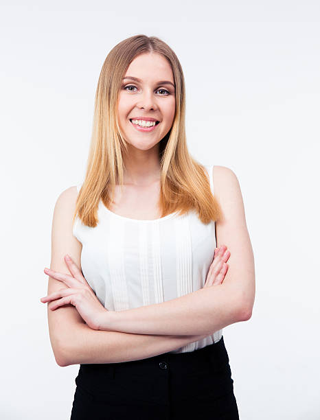 istock Cheerful businesswoman standing with arms folded 475846210