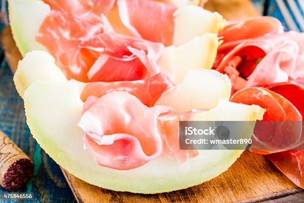 Melon With Thin Slices Of Prosciutto Stock Photo - Download Image Now - 2015, Antipasto, Appetizer
