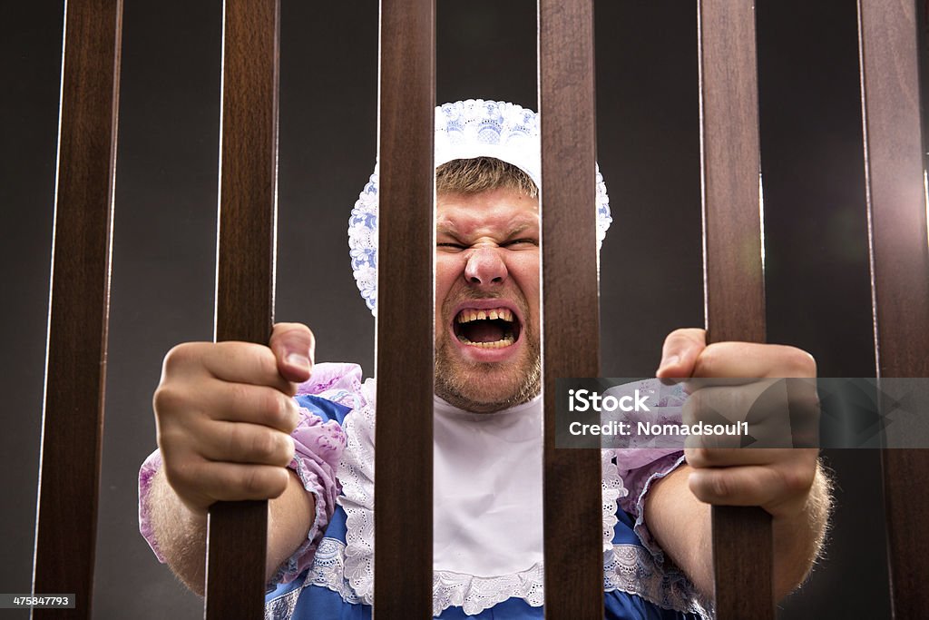 Man trying to get out Man weared as baby trying to get out Actor Stock Photo