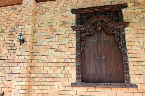 wooden window with traditional Jepara carving ornaments