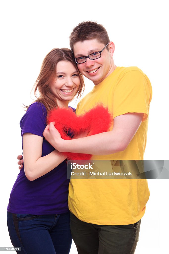 Young happy people in love holding heart Young people in love holding heart 2015 Stock Photo