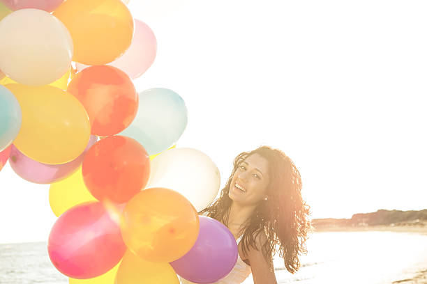 istock loving woman relaxing on the beach warm filter applied 475851504