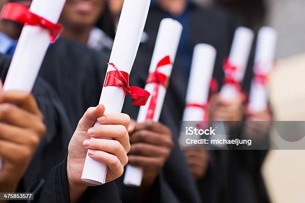 Group Of Graduates Holding Diploma Stock Photo - Download Image Now - Diploma, Graduation, University