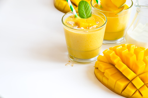 Healthy drink with yogurt and mango sample text background