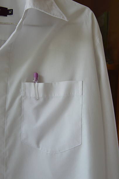 istock pen in white shirt pocket hanging on the wall 475854972