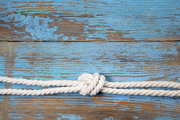 istock Marine knot on wooden background 475857068