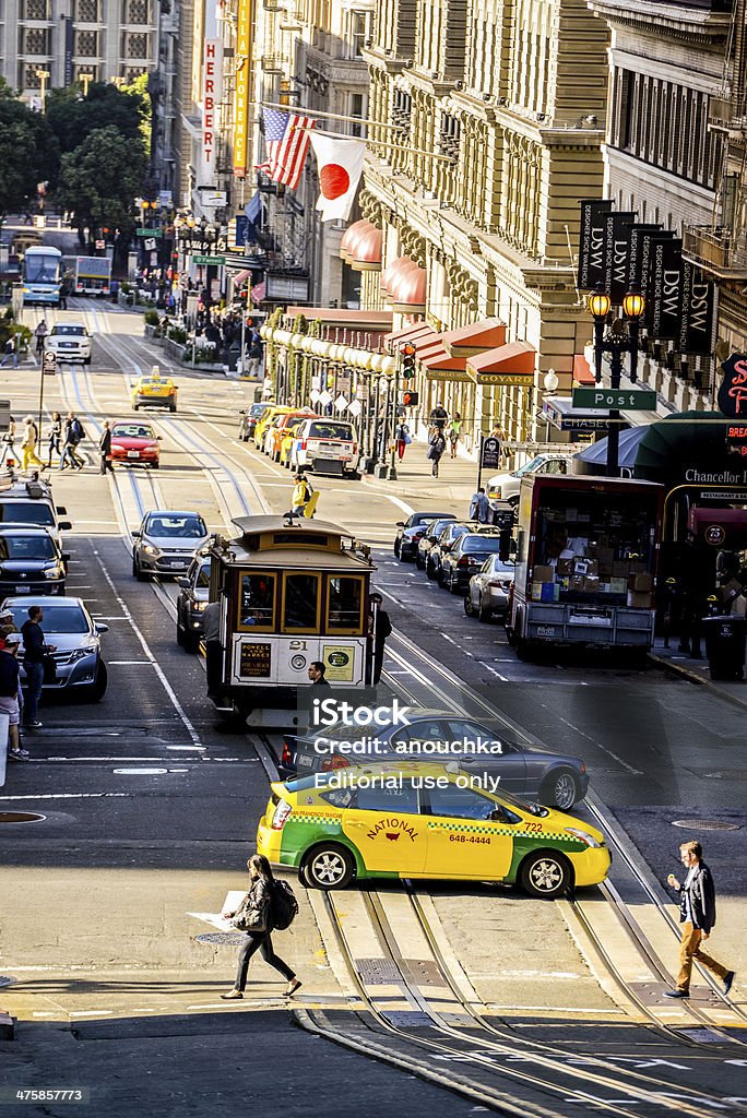 Powell Street, San Francisco, CA, USA San Francisco, USA - May 24, 2013: Powell Street, San Francisco, CA, USA. Hotels, shops, people crossing the street, easy traffic and famous cable car visible on the street. Architecture Stock Photo