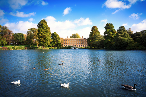 London, United Kingdom - October 27, 2013: Pond with ducks and Museum No 1 in the Royal Botanic Gardens (Kew Gardens, London, UK).