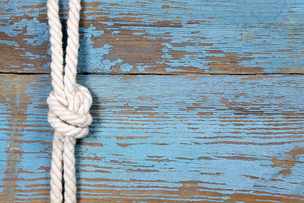 istock Marine knot on wooden background 475860434