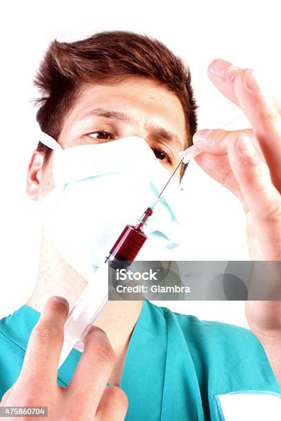 Studio Shot Of A Young Man With Medical Clothes Stock Photo - Download Image Now - 2015, Adult, Assistant