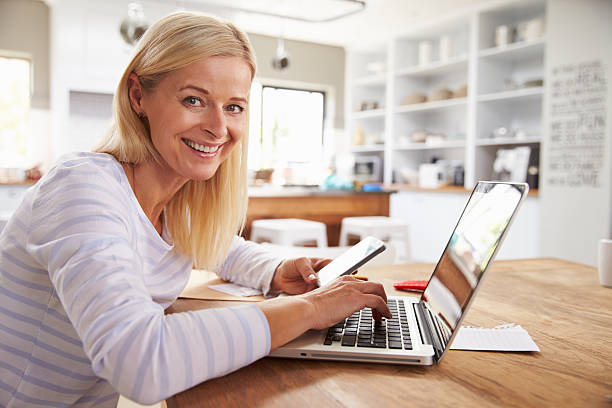 istock Woman working on laptop at home 475863018