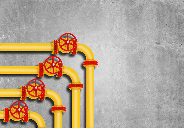 istock Gas pipes on grey wall background 475864568
