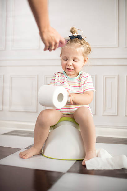 istock Little girl on potty 475865786