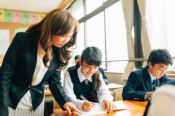 istock Teacher Assisting Students in Japanese Junior High School 475866458