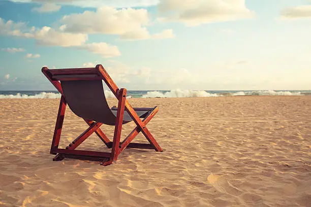 Photo of Chair at a topical beach in sunset