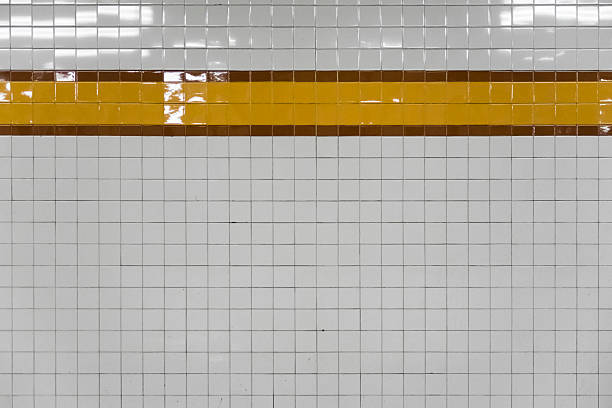 Generic abstract of old subway wall with yellow tiles