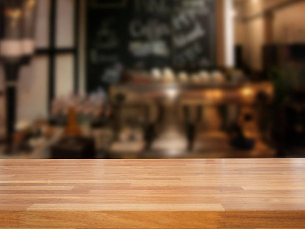 istock mpty wooden table and blurred cafe background 475870446