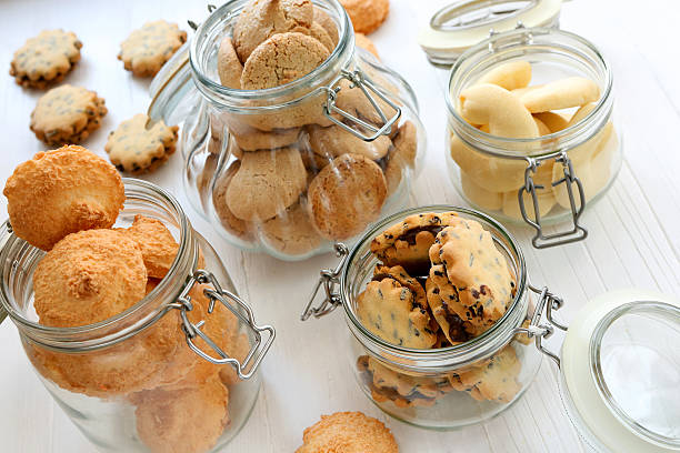 istock Shortbread biscuits in jars on a white wooden background 475870688