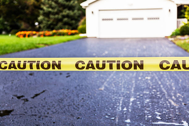 istock Caution Banner Sign on New Asphalt Driveway 475870881