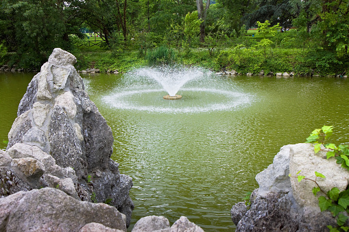 Water fountain in the italian park (Margherita's gardens in Bologna - Italy)