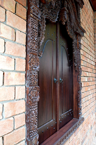 carved wooden doors on Javanese houses