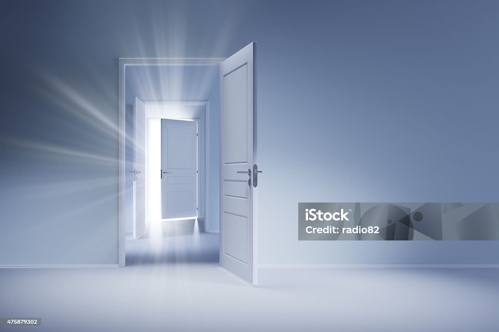 Open white doors with rays of light on blue wall Three open white doors on the blue wall. Rays of light shine through the open door. Door Stock Photo