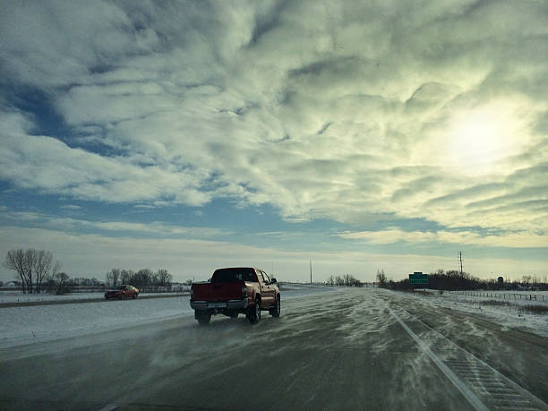 Driving in the dangerous Freeway in winter snowstorm.