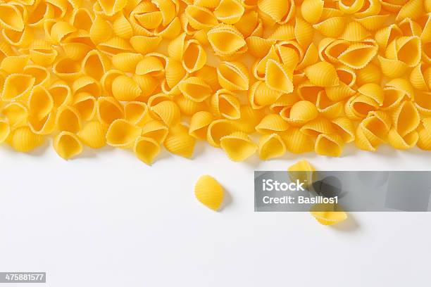 Amber Texture Of Shell Shape Pasta Stock Photo - Download Image Now - Animal Shell, Carbohydrate - Food Type, Close-up