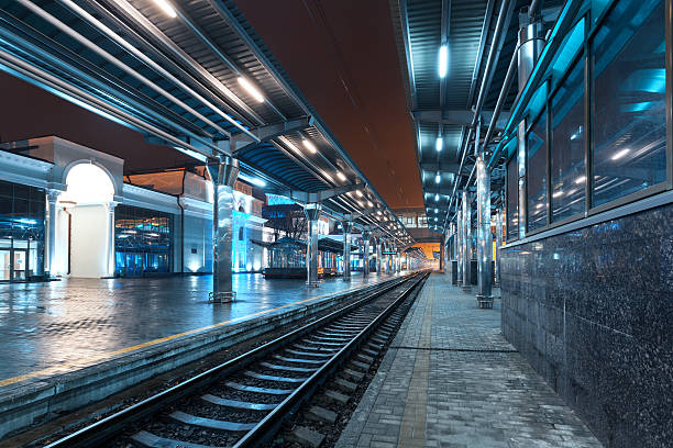 istock Railway station at night. Train platform in fog. Railroad 475882496