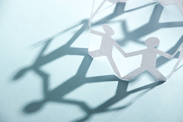 istock Group of people holding hands 475883736