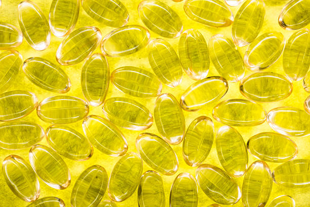 suplemento óleo de cápsulas - fish oil coq10 vitamin e cod liver oil - fotografias e filmes do acervo