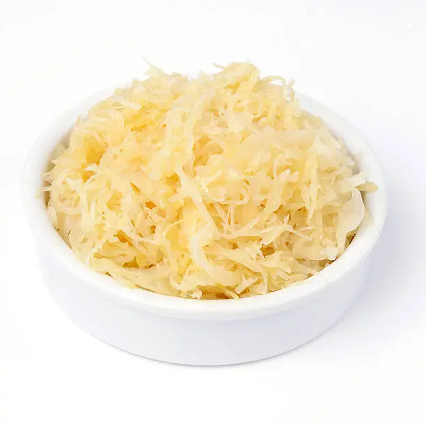 Delicious sauerkraut on plate isolated over white