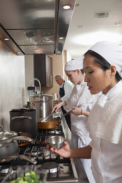 istock Chefs Working Together In Commercial Kitchen 475890161