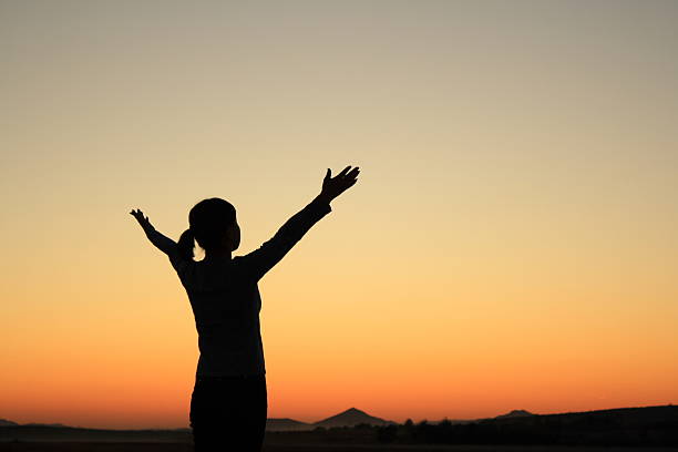 istock Woman at Sunset 475890745