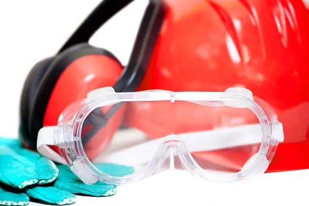 Various working equipment and safety construction gear. helmet, gloves, protection glasses and headphones, isolated on white background