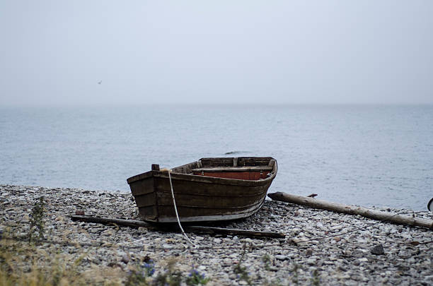 istock Old boat by the sea 475897697