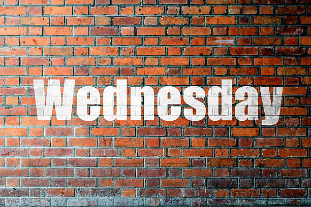 istock Red Brick wall texture with a word Wednesday 475897920