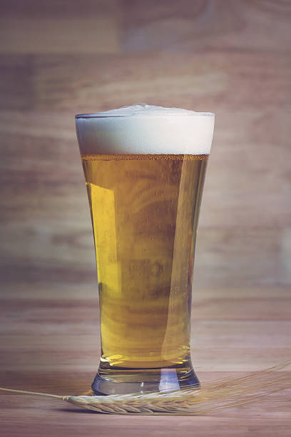 istock Glass beer and bale on wood background, Soft focus 475899146
