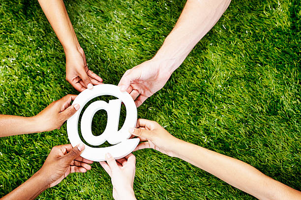 istock What's your address? Modern communication: many hands with @ sign 475905147