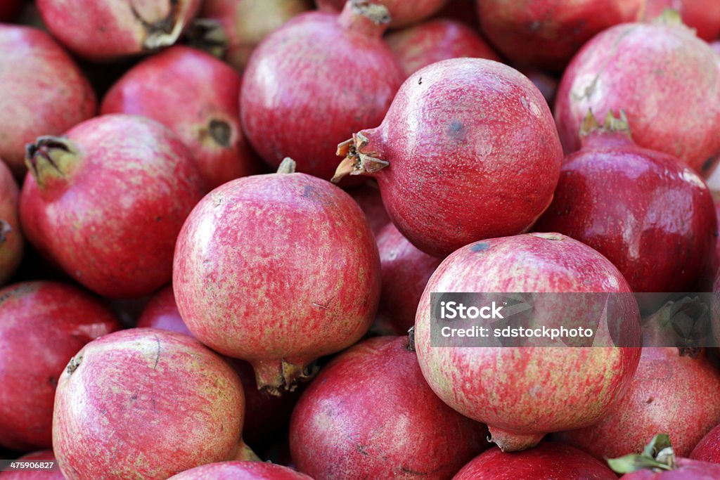 Pile of Gorgeous Pomegranate Fruit Fresh pomegranate fruit with vibrant color. Agriculture Stock Photo