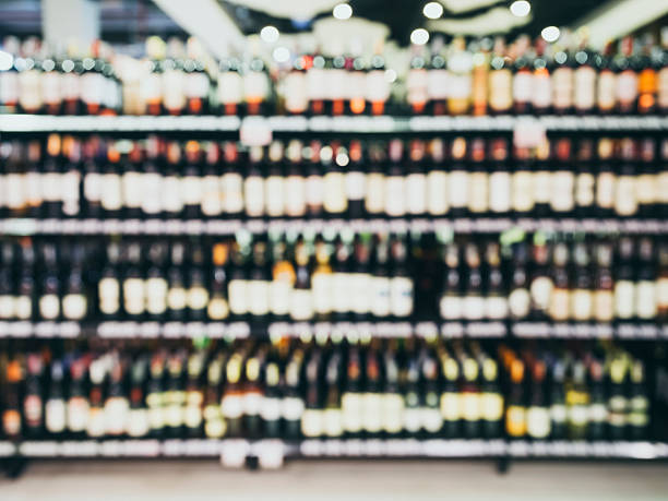istock Blurred Wine Liquor bottle on shelf, Retail store background 475911906