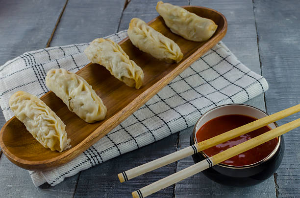 istock steamed momo with red chilly sauce 475913212