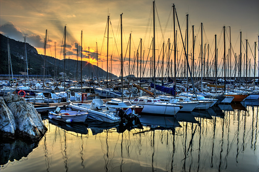 EN - The marina of Capo San Donato is a public port and saw the laying of the first stone in 1964. 
