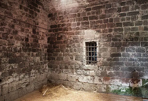 An abandoned prison cell at ancient castle Rocca in Radicofani. Italy.